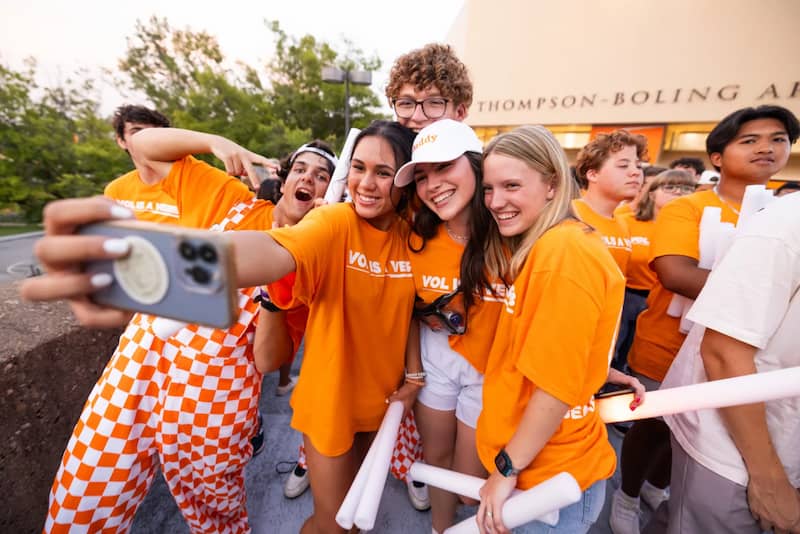 students on campus taking a selfie